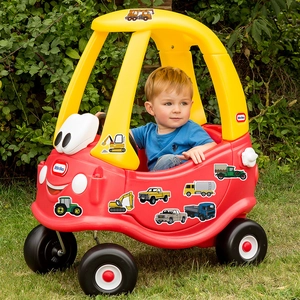 Classic red and yellow cozy coupe toy car with colorful construction truck graffiti stickers
