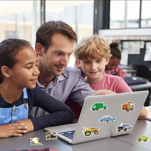 Family bonding over cartoon truck stickers on laptop for fun and educational creative play