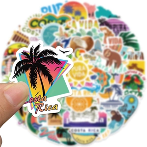 Detailed view of waterproof Costa Rica stickers with tropical sloth and palm tree designs