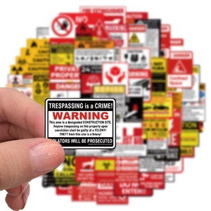 Close-up of waterproof warning stickers showing Trespassing is a Crime and legal text detail