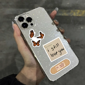 Glitter transparent iPhone case with artistic butterfly and heart collage stickers