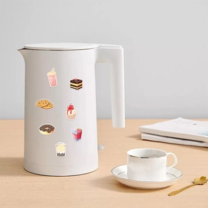 Waterproof food and drink stickers applied to a white kettle on a wooden table