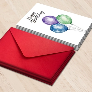 Happy Birthday card set with watercolor balloons and red envelopes on wood background