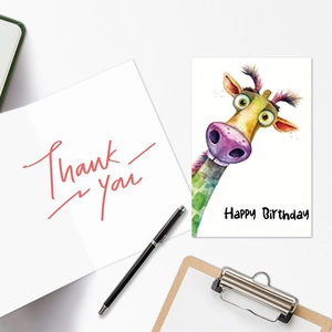 Detailed view of watercolor giraffe birthday card and thank you card with stationery props