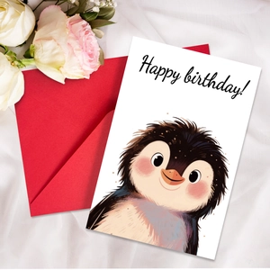 Detail of cute cartoon penguin birthday card and red envelope on silk background