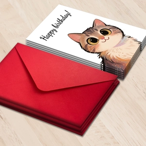 Hand-painted cat birthday card set with red envelopes on light wood background