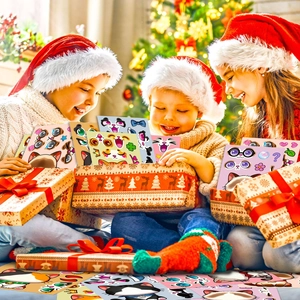 Kids in Christmas hats unboxing DIY cat puzzle stickers from a festive gift box