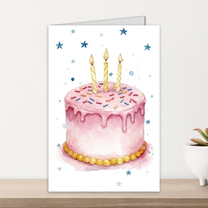 Detail of watercolor three-tier birthday cake card with stars on a wooden desk