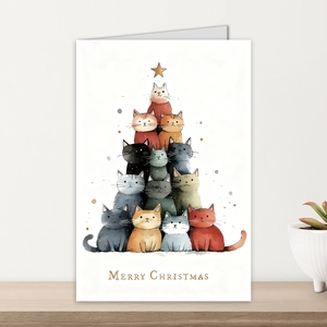 Vertical cat stack Christmas tree card on wood table with Merry Christmas text