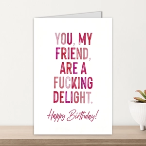 Close-up of minimalist birthday card with funny typography on high-quality paper