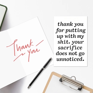 Flat lay of thank you greeting cards set with pen and clipboard on white desk