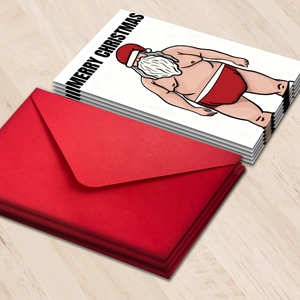 Funny Santa greeting card set with red envelopes and Merry Christmas text on wood surface