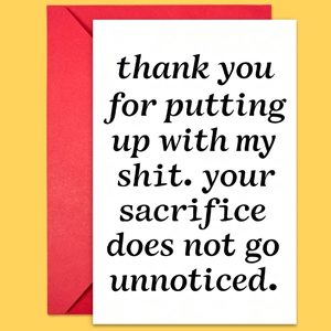 Minimalist white greeting card with humorous text and a classic red envelope