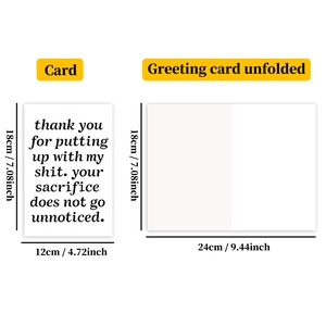 Macro detail showing white greeting card dimensions and minimalist folded typography design