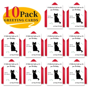 Flat lay of 10 funny birthday cards with black cartoon cats and red envelopes