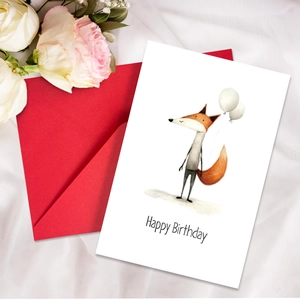 Detail of happy birthday card with cute fox illustration and red envelope on silk