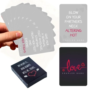 Close-up of Night of Love couple card game showing black gift box and interaction cards