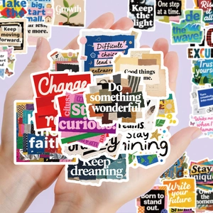 Close-up of creative English inspirational scrapbooking stickers with artistic typography