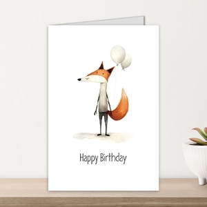 Detail of happy birthday card with hand-drawn fox and balloons on wooden shelf