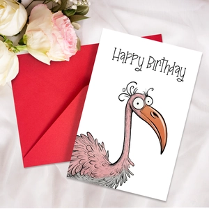 Close-up of birthday card with watercolor bird illustration and red envelope on silk