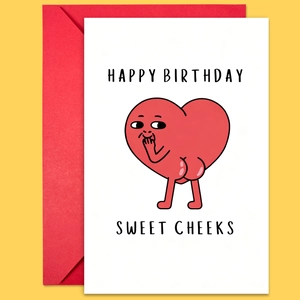 Close-up of funny cartoon heart birthday card with red envelope and bold yellow background