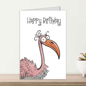 Detailed view of watercolor pink bird greeting card with Happy Birthday text on wood stand