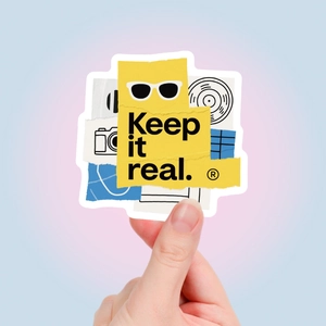 Detail of Keep It Real graffiti sticker with street art elements for scrapbooking