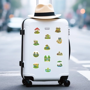 Detailed view of 12 cute green frog stickers applied on a white suitcase for decoration