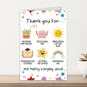 Detailed view of an English greeting card with colorful cartoon icons on wood background