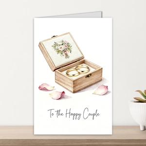 Detail of a large watercolor wedding card for happy couples featuring rings and flowers