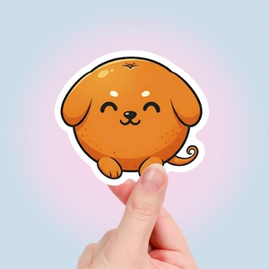 Detail of waterproof orange puppy sticker held by hand to show size and quality