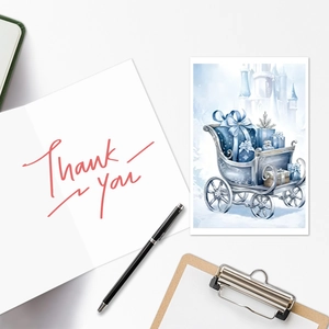 Close-up of blue watercolor Christmas thank you card and festive sled illustration