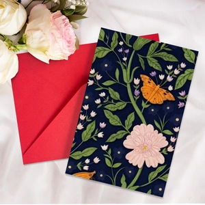 Artistic vintage floral greeting card with red envelope on white silk backdrop