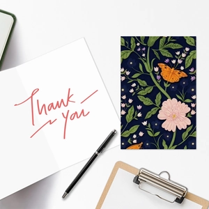Detail showing vintage butterfly floral greeting card with handwritten Thank You script