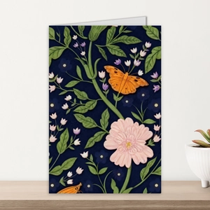 Close-up of vintage botanical card with flower and butterfly on a wooden table