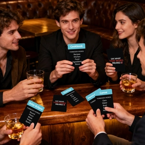 Close-up of English word game cards being played by a group of people at a social party