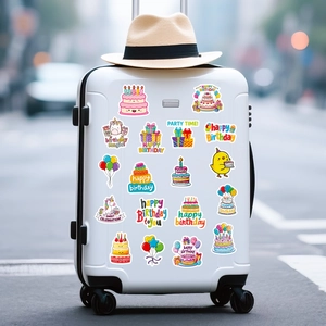 Waterproof birthday stickers with cakes and balloons applied on a white suitcase