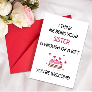Macro view of humor sister birthday card on red envelope with white silk background