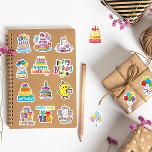 Detailed stickers with cute birthday cakes and colorful balloons on a notebook