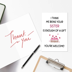 Macro view of funny sister birthday card with cake illustration and a thank you envelope