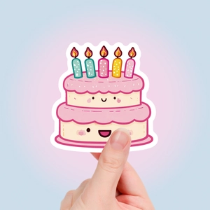Detail of cute cartoon birthday cake sticker with candles and kawaii face design