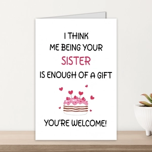 Detail of funny sister birthday card with cake illustration on minimalist wood shelf