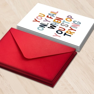 Inspirational greeting card set with red envelopes and bold motivational typography print