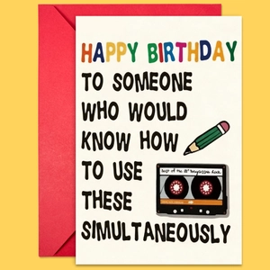 Flat lay of vintage 80's rock birthday card set with a red envelope on yellow background