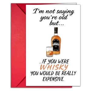 Detail of creative birthday card with whiskey illustration and a vibrant red envelope