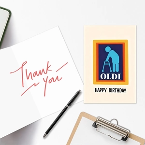 Detailed close-up of funny Oldi birthday card and thank you card set on office desk
