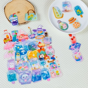 Detail of cute PET stickers with animals in transparent bottles on wooden stands