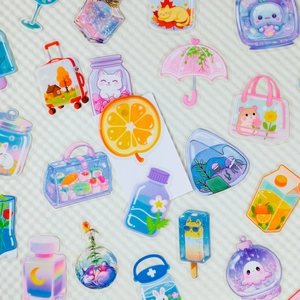 Close-up of cute transparent PET stickers with various colorful cartoon patterns