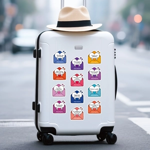 Inspirational cartoon envelope stickers applied on a white hard-shell travel suitcase