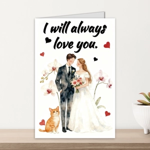 Detailed view of a watercolor wedding card with a couple and cat on a wooden table